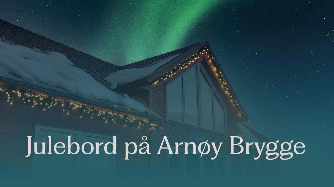Julebord på Arnøy Brygge. Arnøy Brygge under nordlyset med snø på taket. 